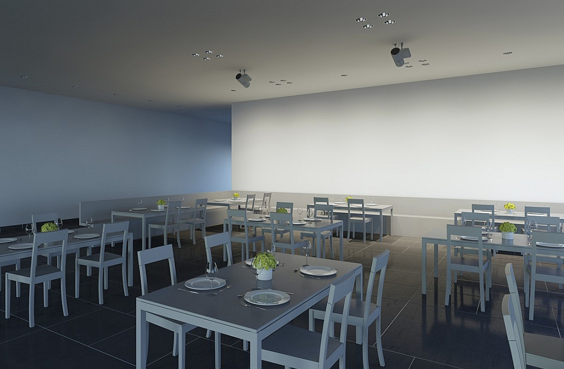 ERCO lighting design in a restaurant: Accent lighting on tables with ceiling spotlights for ambiance.