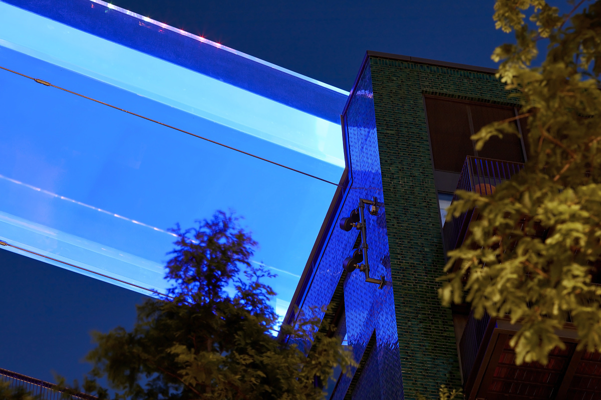 Sky Pool in London illuminated by blue LEDs and ERCO Kona projectors for atmospheric lighting.