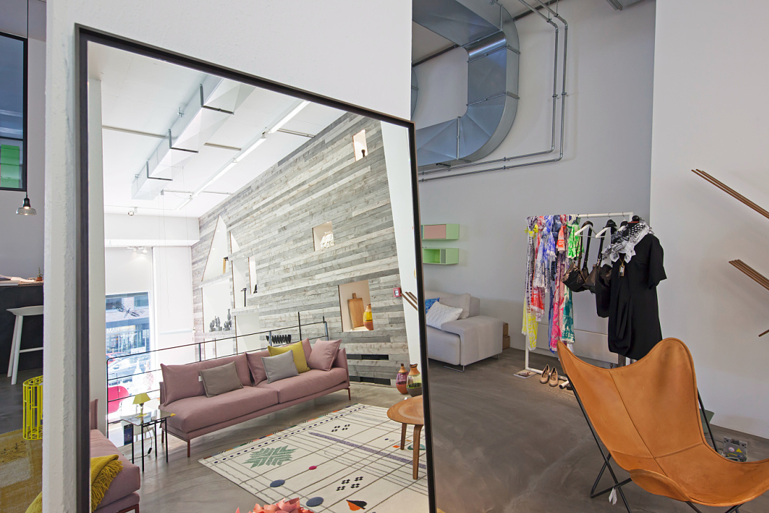 Reflection of Sleeping Dogs store featuring ERCO LED lighting highlighting furniture and accessories.