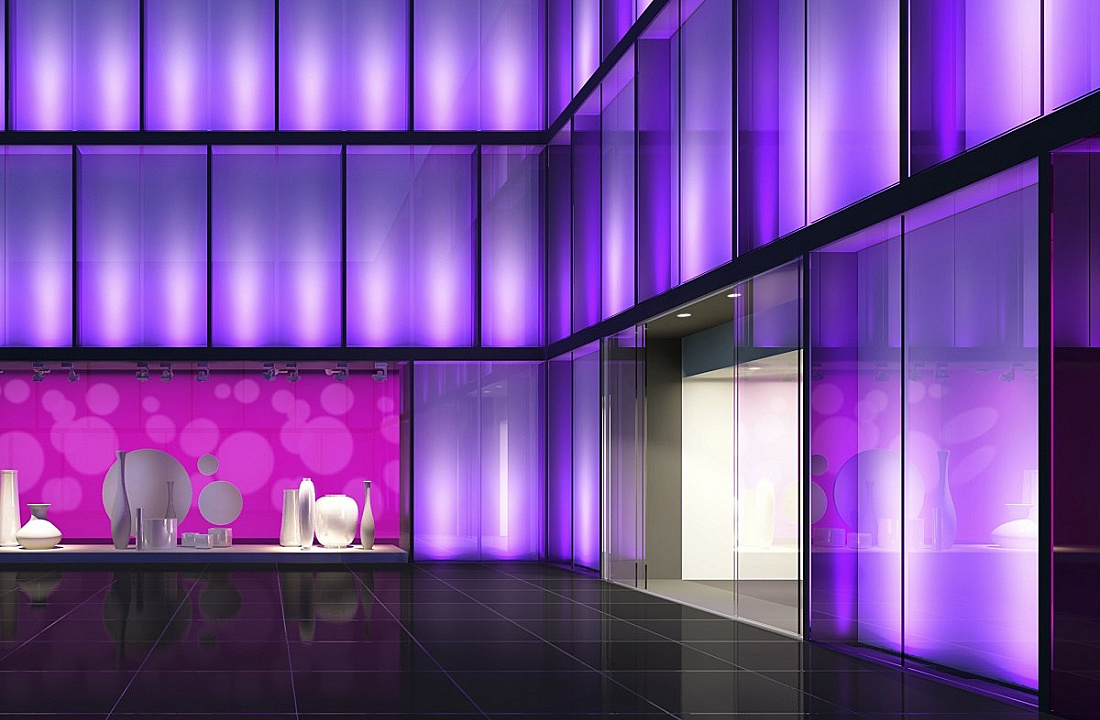 ERCO lighting design showcasing dynamic facade illumination with color changes and accents for a retail store.