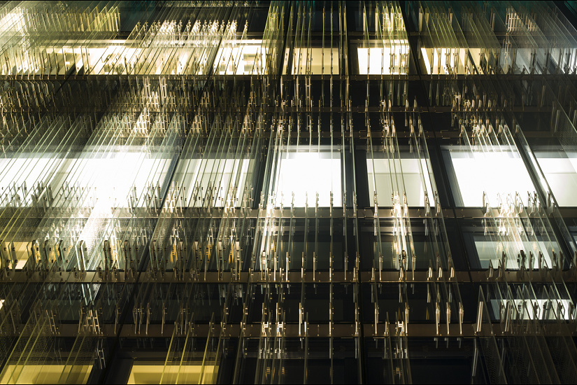SPG Headquarters Geneva facade with ERCO LED lighting creating a unique building illumination.