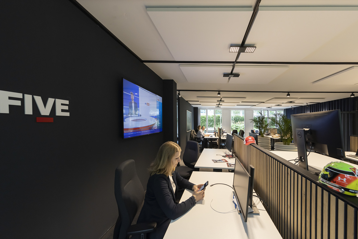 Sportfive GmbH office featuring ERCO Jilly downlights for flexible, visually comfortable workplace lighting.