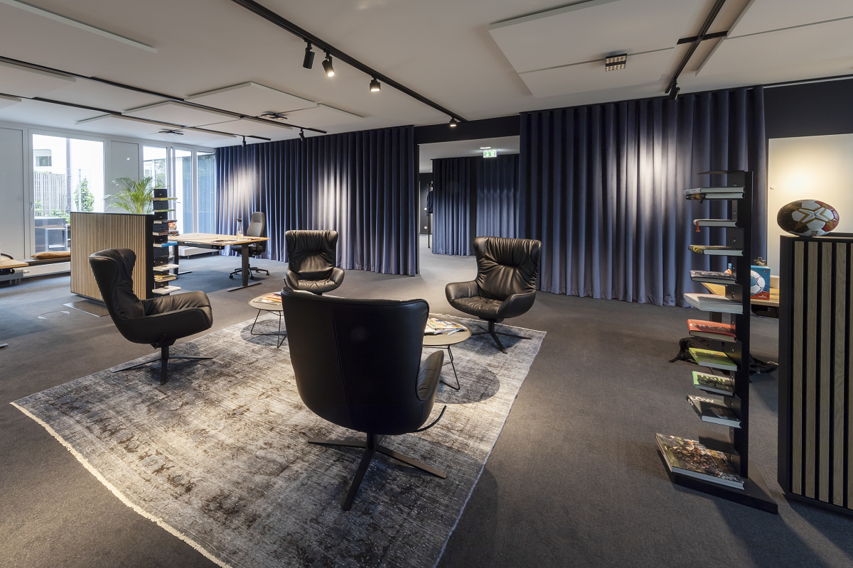 Sportfive GmbH office featuring ERCO downlights for flexible workplace lighting and visual comfort.