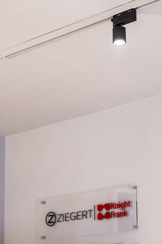 ERCO Pollux spotlight on track lighting in ZIEGERT Knight Frank shop, Frankfurt.