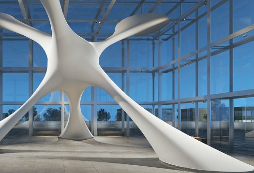 Abstract white sculpture in a modern glass building, illuminated with ERCO lighting.