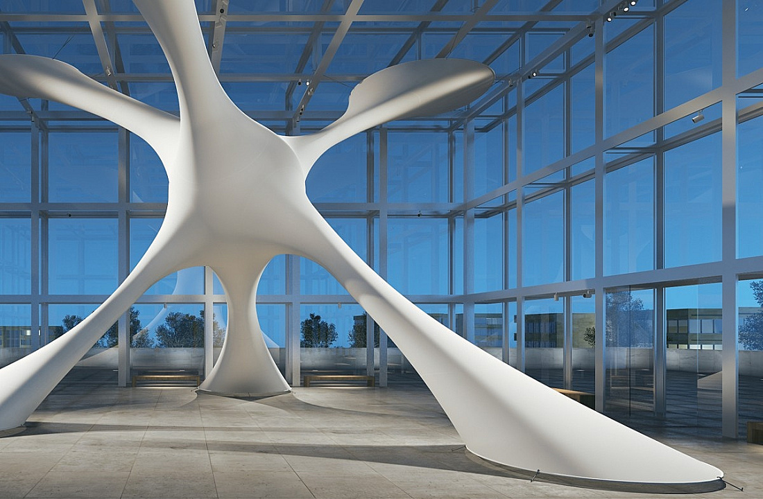 Abstract sculpture in a glass building, illuminated with ERCO lighting to emphasize form.