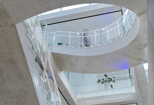 Stairwell in the SQUARE Learning Center at the University of St. Gallen, featuring ERCO lighting.