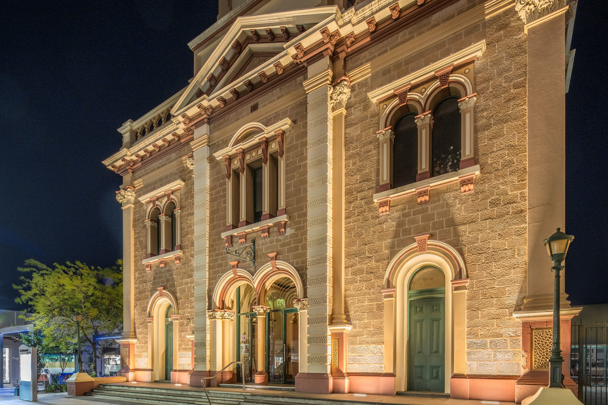 St Andrews Church facade illuminated at night with ERCO grazing light, enhancing textures.