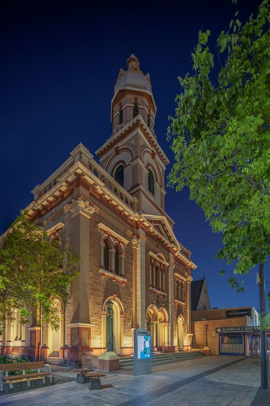 St Andrews Church facade illuminated at night with ERCO Site in-ground luminaires, emphasizing texture.