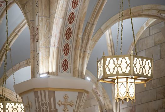 ERCO Atrium pendant light in St. Joseph Church, Indiana, accenting vaulted ceilings and altar with warm light.