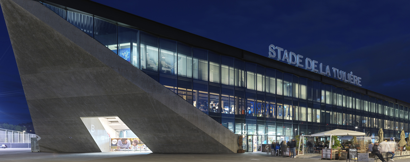 Stade de la Tuilière in Lausanne, featuring ERCO LED lighting for visual comfort.