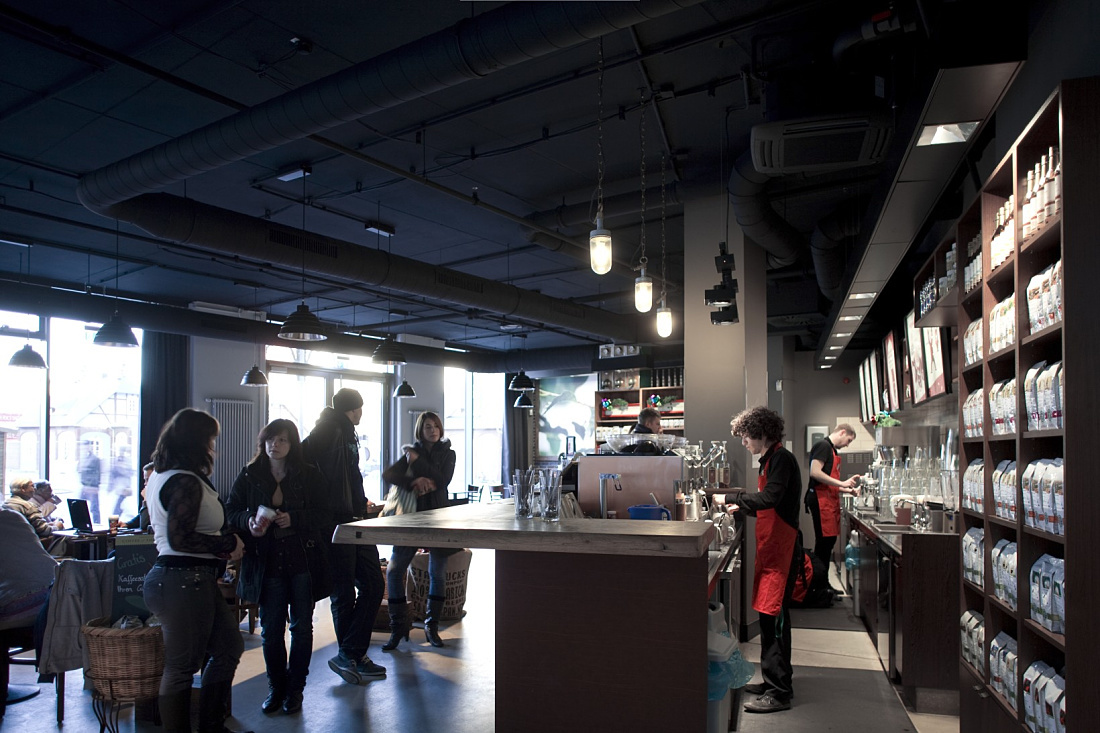 Starbucks interior at Altmarkt featuring LED lighting for visual comfort and sustainability.
