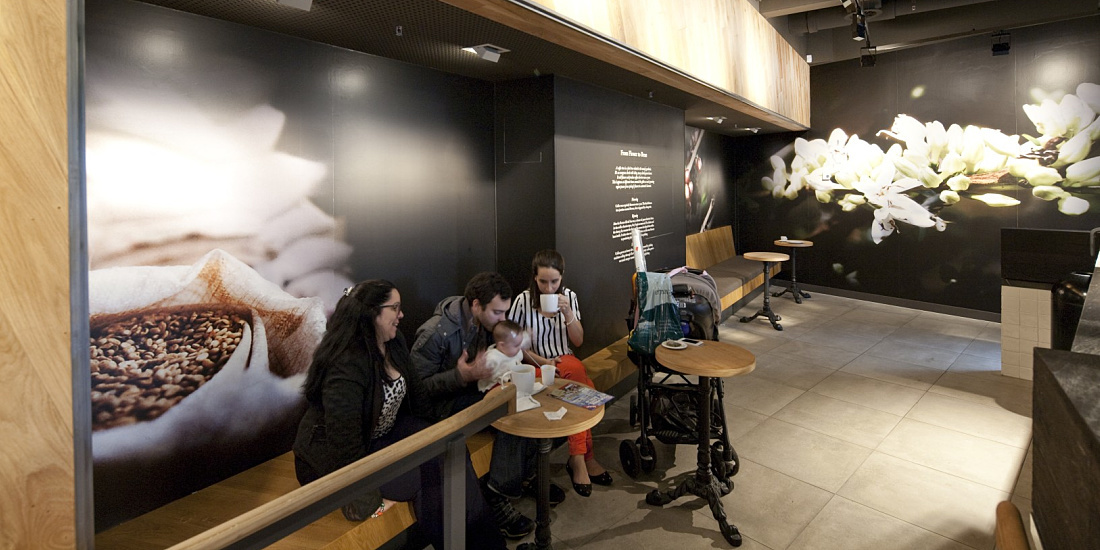 Interior of a Starbucks Coffee House in Berlin, featuring ERCO LED lighting for a welcoming atmosphere.