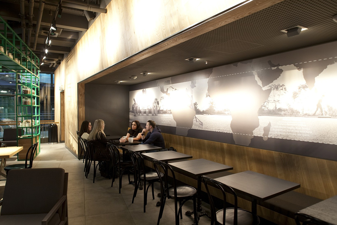 Starbucks Coffee House in Berlin featuring ERCO LED lighting for a welcoming ambiance.
