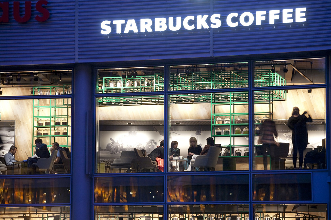 Starbucks Coffee House in Berlin featuring ERCO LED lighting for a welcoming ambiance.