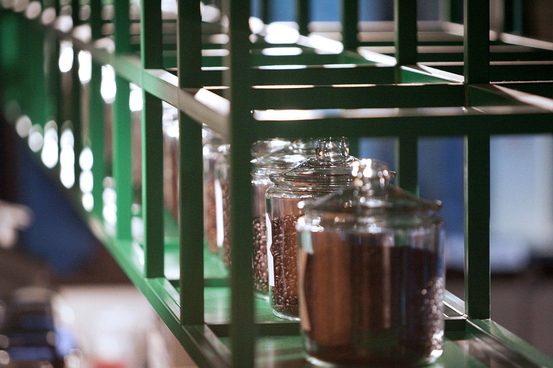 Decorative coffee beans in glass jars on a shelf at the Starbucks Coffee House, Berlin.