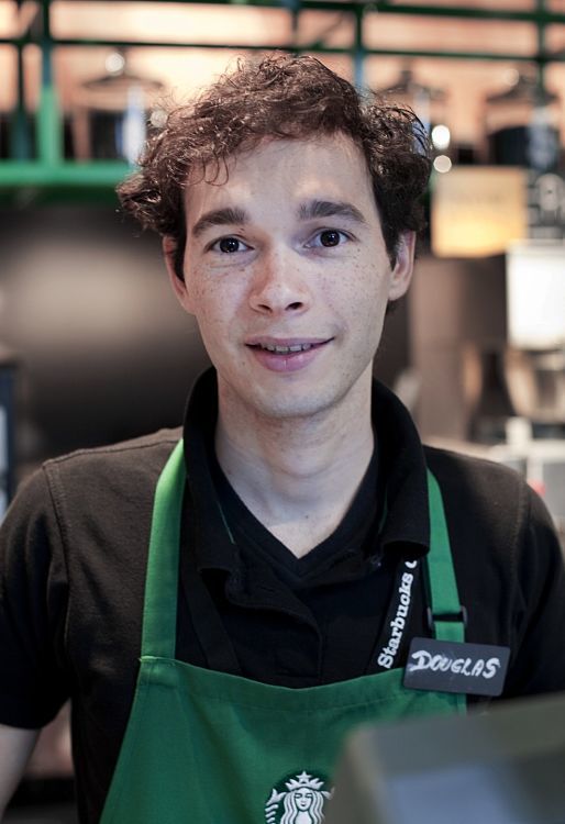 Starbucks employee Douglas in Berlin, providing a sense of well-being.