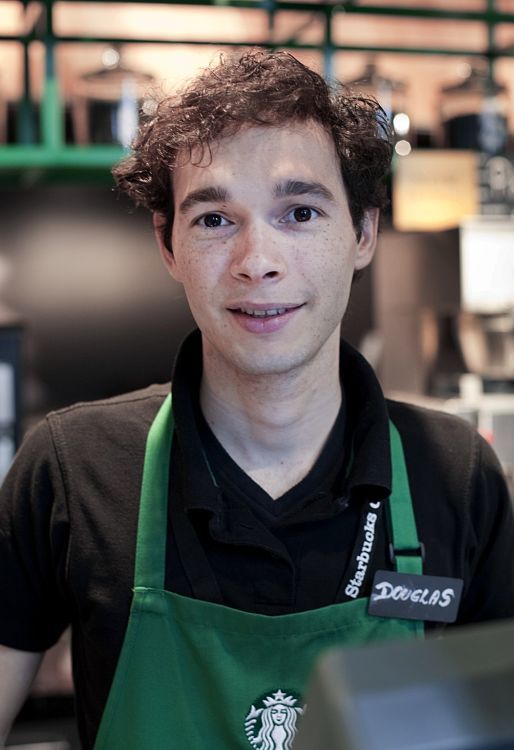 Starbucks employee Douglas in Berlin, providing a sense of well-being.