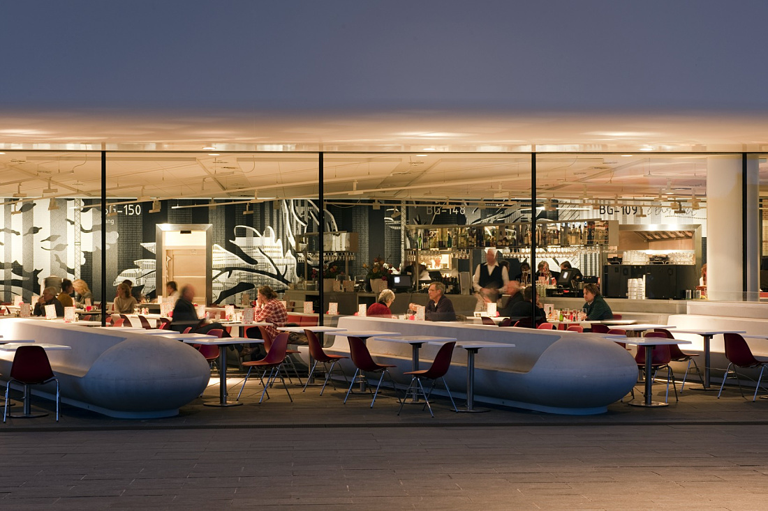 Illuminated restaurant at Stedelijk Museum, Amsterdam, with ERCO LED lighting.