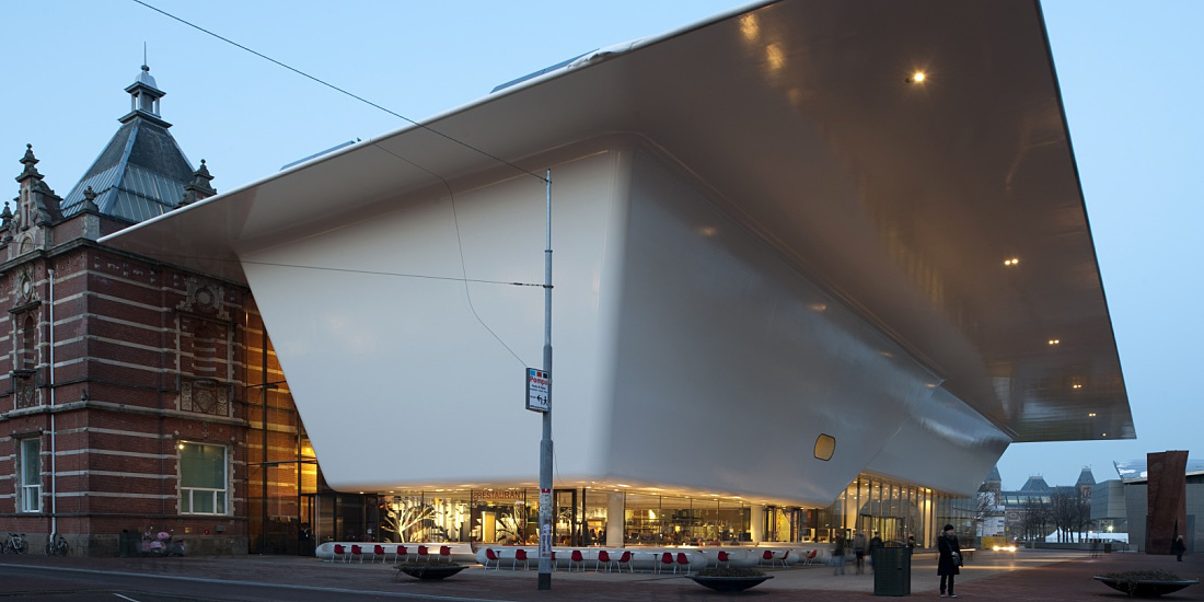 Stedelijk Museum Amsterdam illuminated by ERCO LEDs, showcasing modern art.