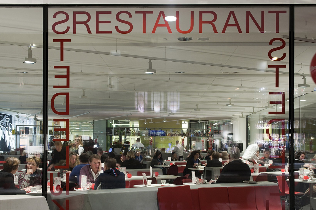 Stedelijk Museum restaurant in Amsterdam, illuminated by ERCO LED lighting.