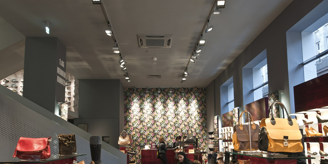 Interior of Stiefelkönig shoe shop illuminated by ERCO Light Board LED spotlights for accent lighting.
