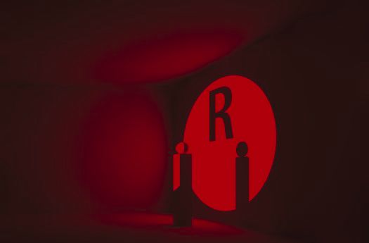 Subtractive color mixing with red light and the letter R.