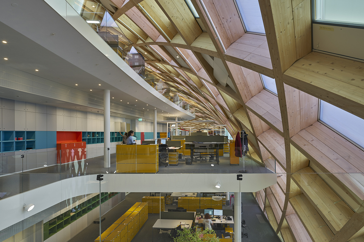 Interior of Swatch HQ in Biel, Switzerland, featuring ERCO Gimbal recessed floodlights for glare-free lighting.
