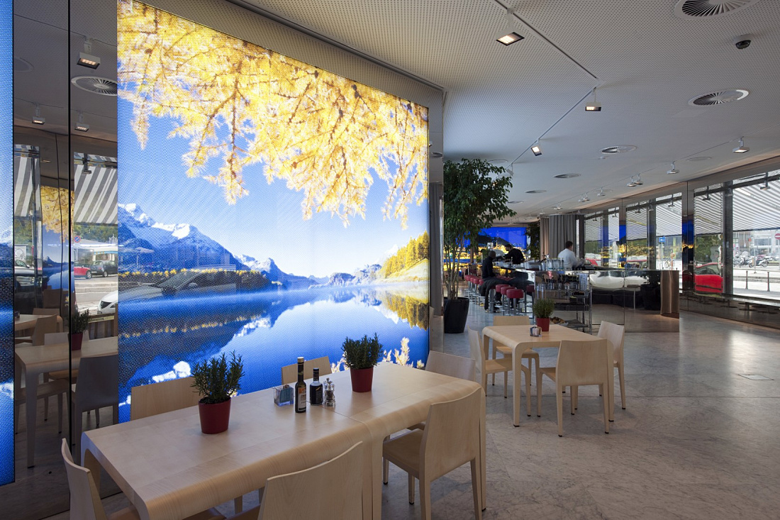 Swiss Corner Bar in Milan featuring ERCO Light Board spotlights, creating a modern and functional lighting design.