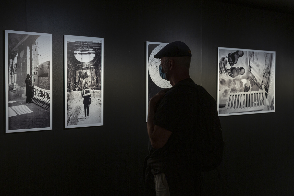 A visitor views illuminated exhibits in the Teatre-Museu Dalí, lit by ERCO spotlights.