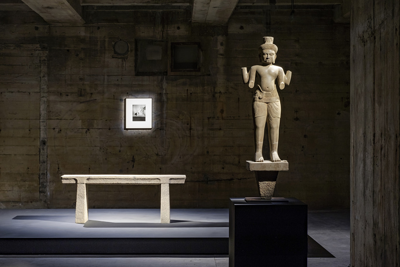 Illuminated Khmer sculpture and stone table in the Feuerle Collection, Berlin.