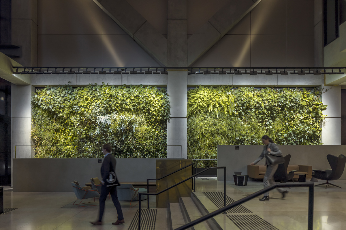 Green wall in 565 Bourke Street foyer, illuminated by ERCO Light Board spotlights for plant growth.