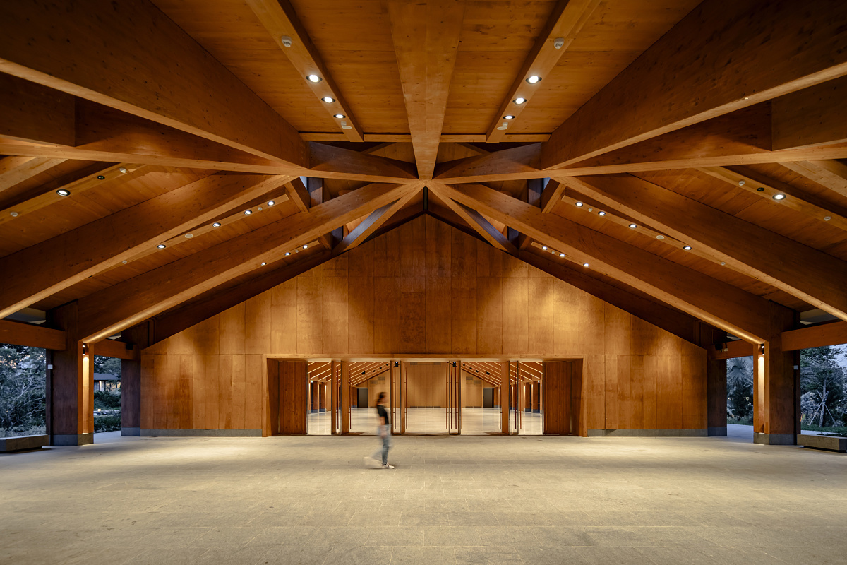 The Guesthouse interior in Singapore, featuring ERCO LED lighting highlighting the timber structure.