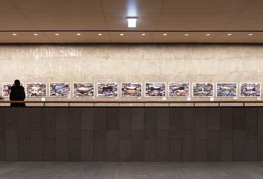 ERCO lighting design at Rosary Hill: Visitor views illuminated artwork on the wall.