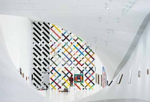 Interior of The Twist museum featuring art, illuminated by ERCO Parscan spotlights.