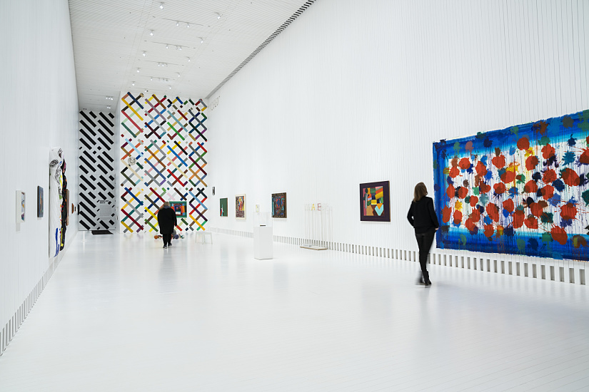 Interior of The Twist gallery featuring art illuminated by ERCO Parscan spotlights.