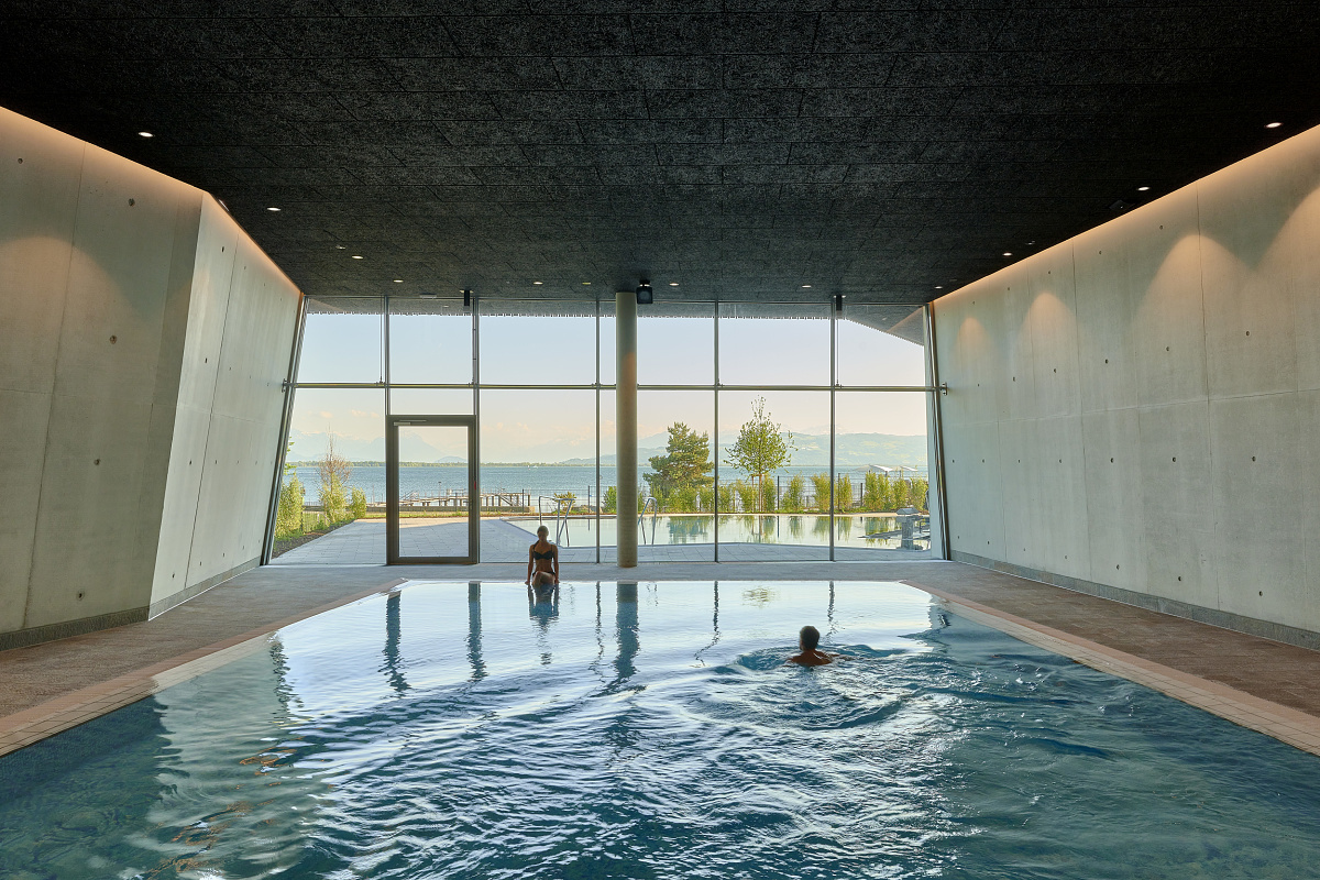 Indoor pool at Therme Lindau, lit with ERCO downlights for visual comfort.