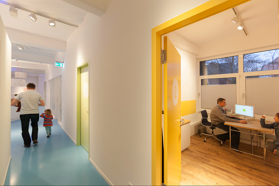Hallway of Uhlig pediatric practice illuminated by flexible Optec LED spotlights.
