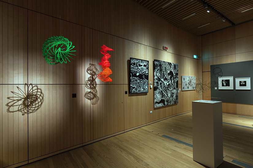 Art exhibit at UniCredit Pavilion, Milan, illuminated with ERCO LED spotlights for accent lighting and visual control.