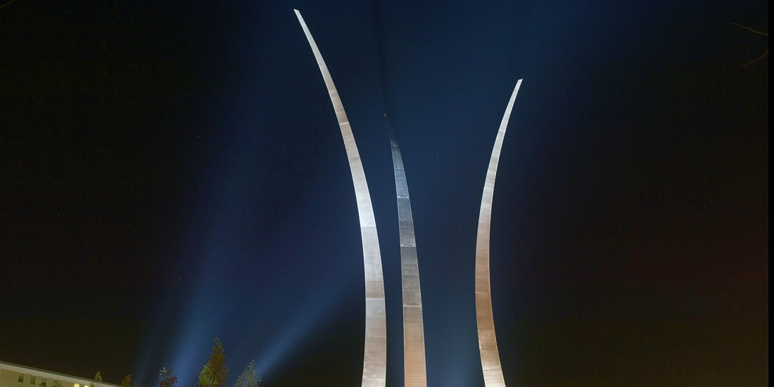 US Air Force Memorial's illuminated spires in Arlington, featuring Beamer spotlights at night.