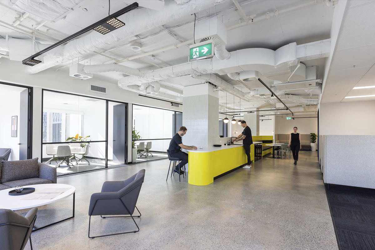 Flexible office lighting with Jilly downlights for track in the Valmont Office, Sydney.