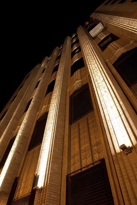 Close-up of the illuminated Walker Tower in New York, featuring ERCO lighting projectors.