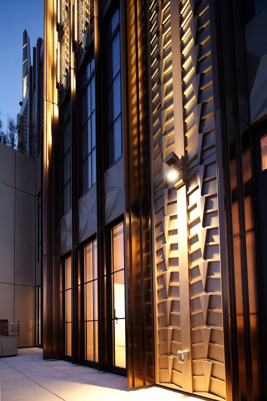 Close-up of the Walker Towers facade, illuminated by ERCO Grasshopper projectors.