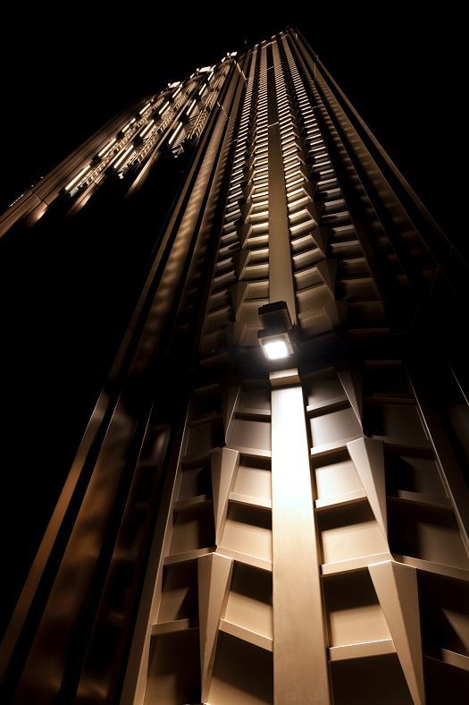 Illuminated Walker Tower in New York featuring detailed Art Deco facade and ERCO lighting.
