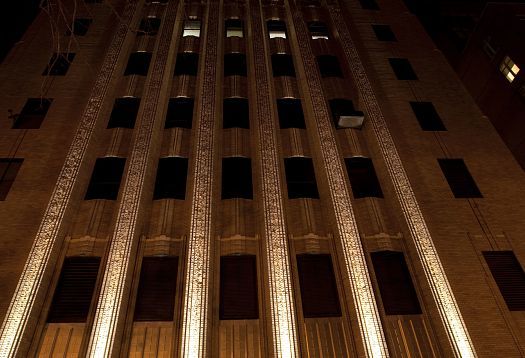 Close-up of the illuminated Walker Tower in New York, featuring ERCO Grasshopper projectors.