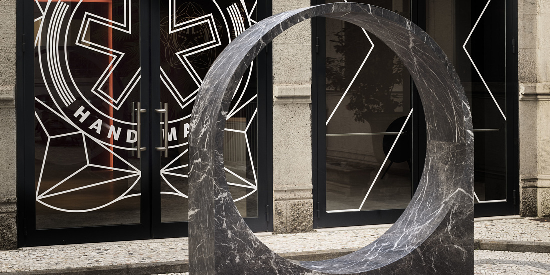 Marble ring sculpture at the Wallpaper Handmade Exhibition entrance in Milan.