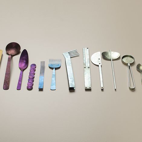 Handmade cutlery set displayed at the Wallpaper Handmade Exhibition with ERCO lighting.