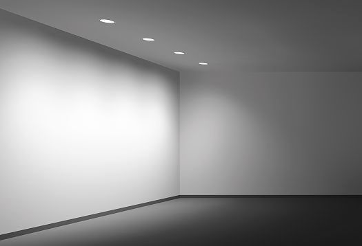 Vertical lighting on a wall using ceiling lights, also known as wallwashing.