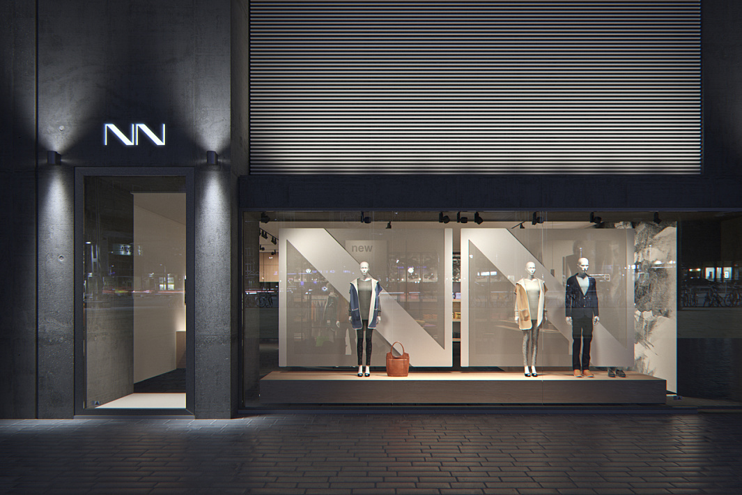 Illuminated facade of an NN clothing store with mannequins displaying new fashion in the shop window.