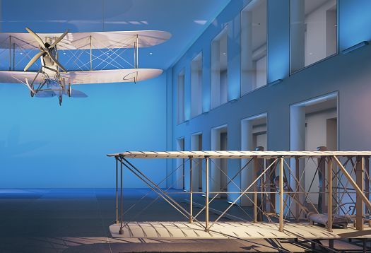 Aircraft models in a museum, illuminated with colored light to accentuate the exhibits.